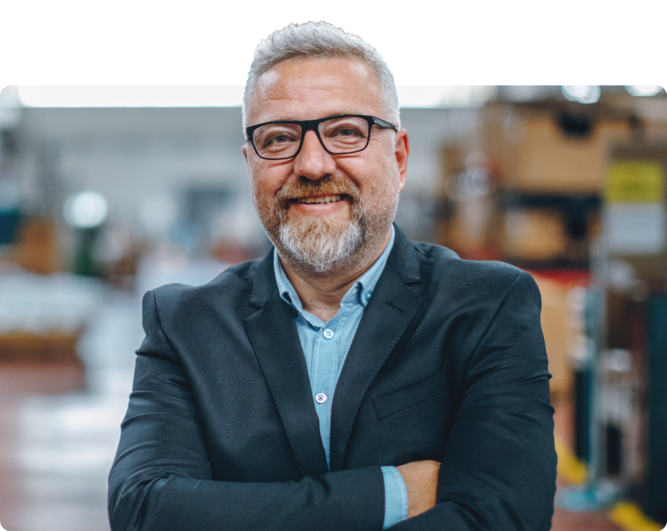 A portrait of a smiling man who increased his financial security with the help of GuidePlan's automated financial wellness programs.